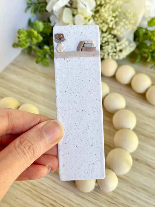 Book Stack with Flower Vase on Bookshelf Bookmark